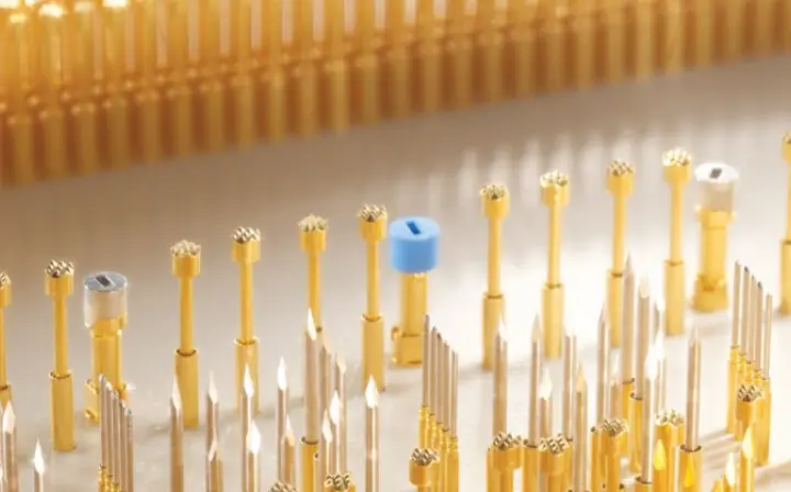 ICT vs FCT: close-up of pogo-pin probes used in bed-of-nails ICT for connectivity and parametric checks on PCBs.