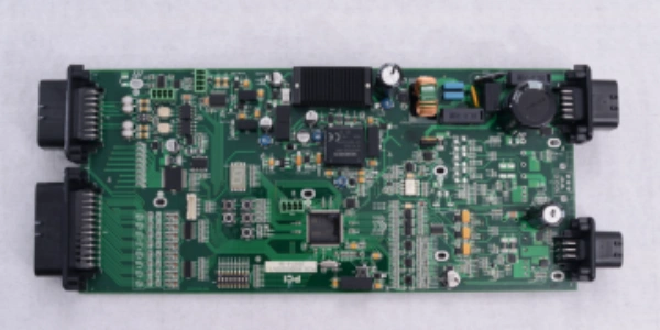 Fully assembled printed circuit board assembly with mixed SMD/THT parts after reflow soldering and inspection.