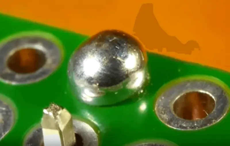 Close-up of a shiny through-hole solder joint—example of acceptable workmanship under IPC-J-STD-001 ipc standards for soldering.