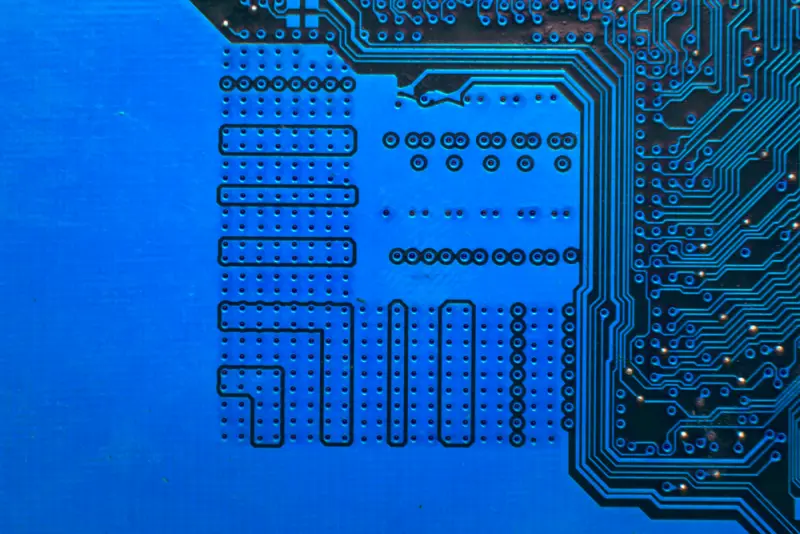 Close-up of a black PCB prototype with fine traces and components, perfect for high-speed signal testing in prototyping for SSDs or networking devices.