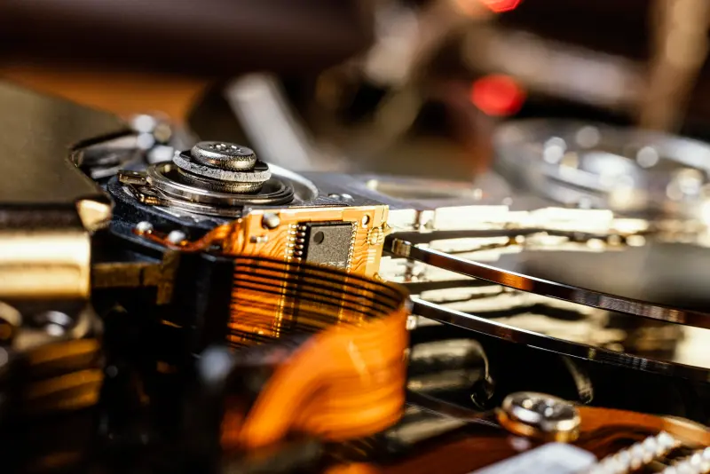 Hard-drive actuator with flex PCB cable and read/write head—flex-circuit considerations in PCB assembly design.