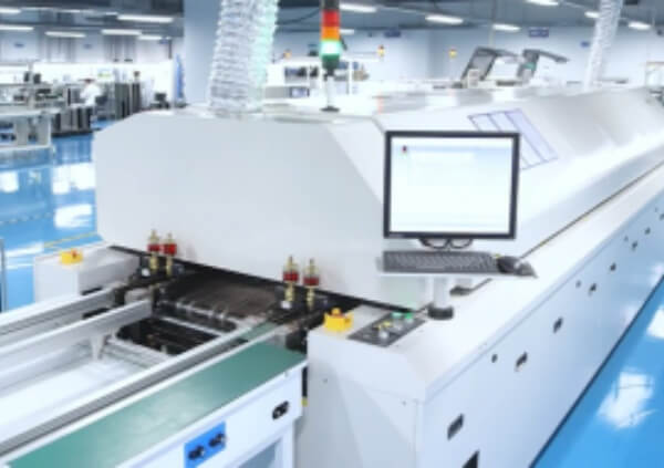 Automated PCB manufacturing assembly line with robotic arms and conveyor belts for high-efficiency production.