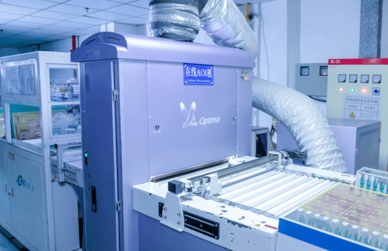 Automated Optical Inspection (AOI) machine for quality control in PCB manufacturing, checking for defects and soldering issues.