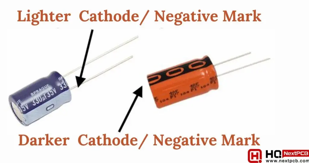 Radial electrolytic capacitors showing lighter and darker sleeve stripes used to mark the negative cathode lead