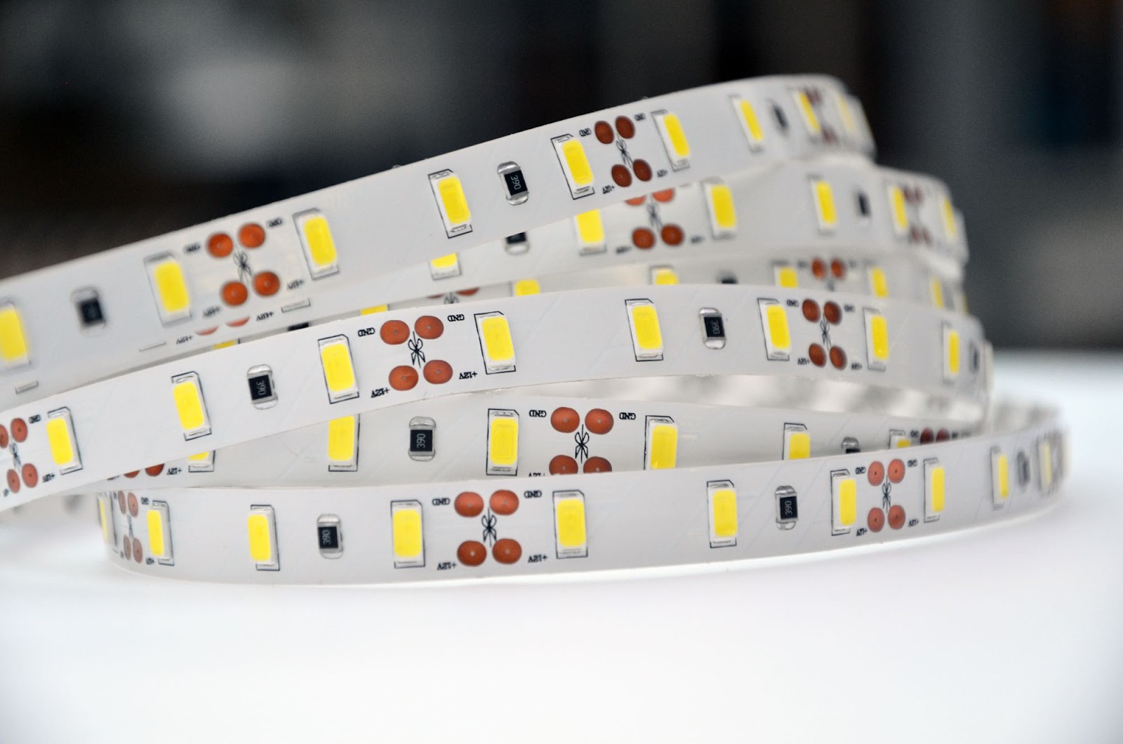 Custom rectangular LED PCB assembly with green solder mask and integrated lighting circuitry.