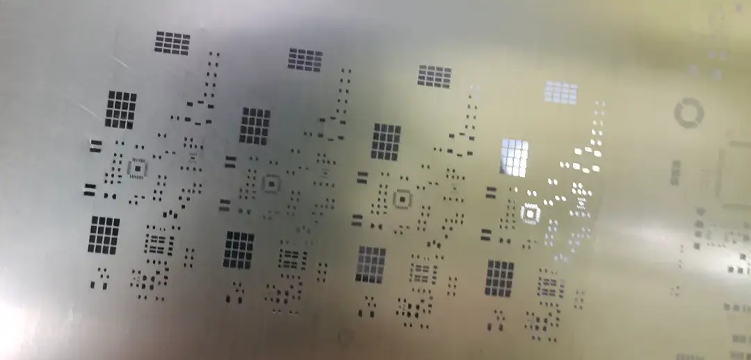 High-precision laser-cut SMT stencil for fine-pitch QFP and 0201 component assembly.