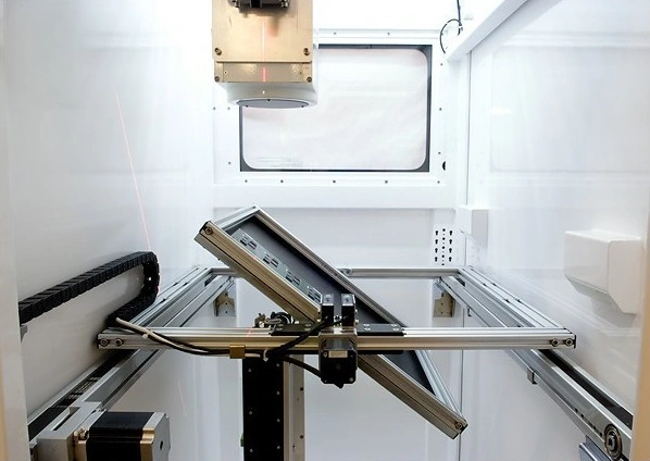 Interior of SCIENSCOPE X-SCOPE-2000 showing the mechanical tilting stage angled at an oblique position for 2.5D X-Ray imaging of PCBA solder joints