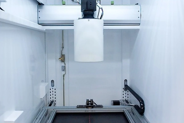 Closed X-Ray tube inside the SCIENSCOPE X-SCOPE-2000, showing the 5-micron focal spot tube head positioned above the inspection stage